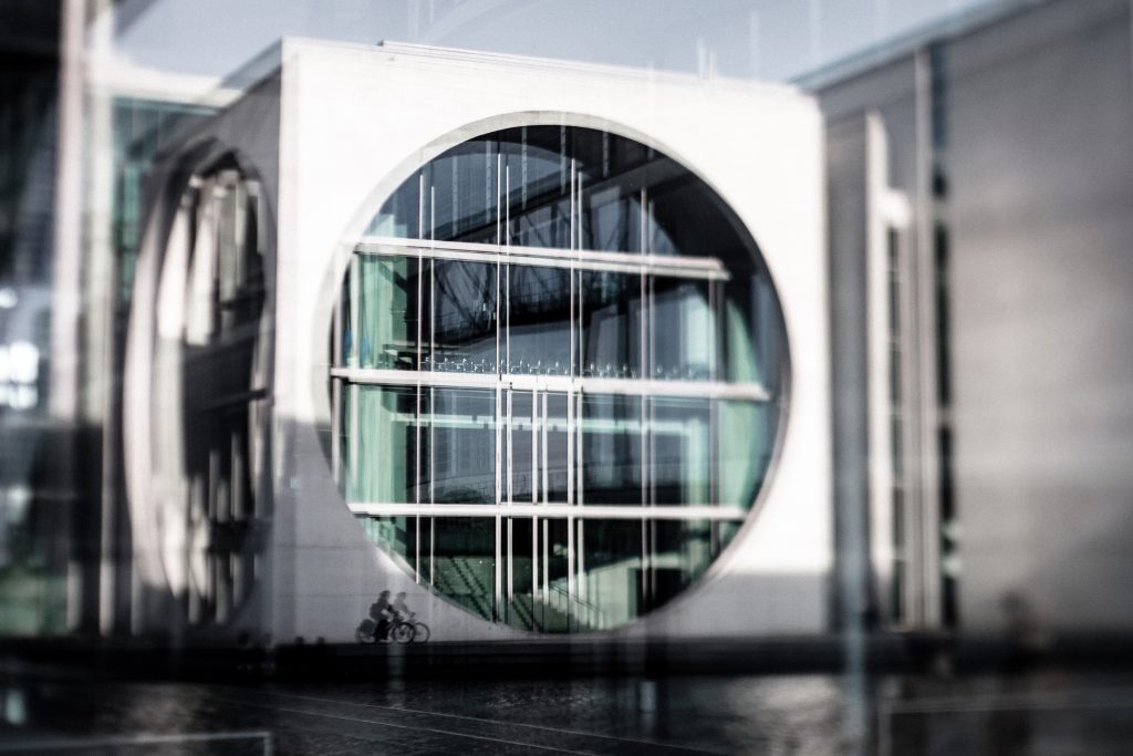 The washing Maschine, reflected in the windows of the building opposite